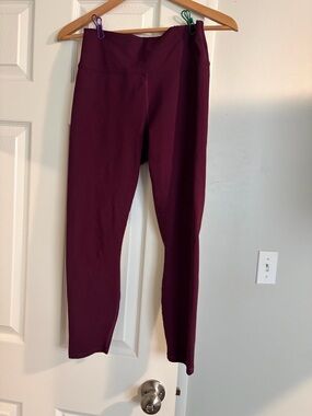 Women’s Purple/Maroon Fabletic leggings with criss- cross back.